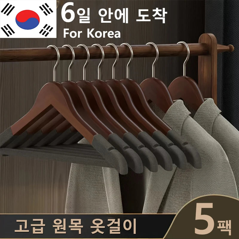 Five-piece non-slip wooden hanger set in light and dark finishes
